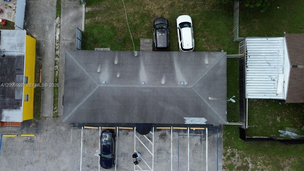 Aerial view shows the freestanding medical office on NW 183rd St with front parking, rear yard area, and convenient access to US-441, I-95, and Florida’s Turnpike.