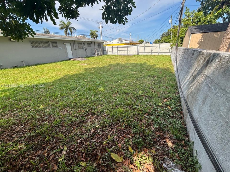 Rear exterior view highlighting additional open area behind the medical office.