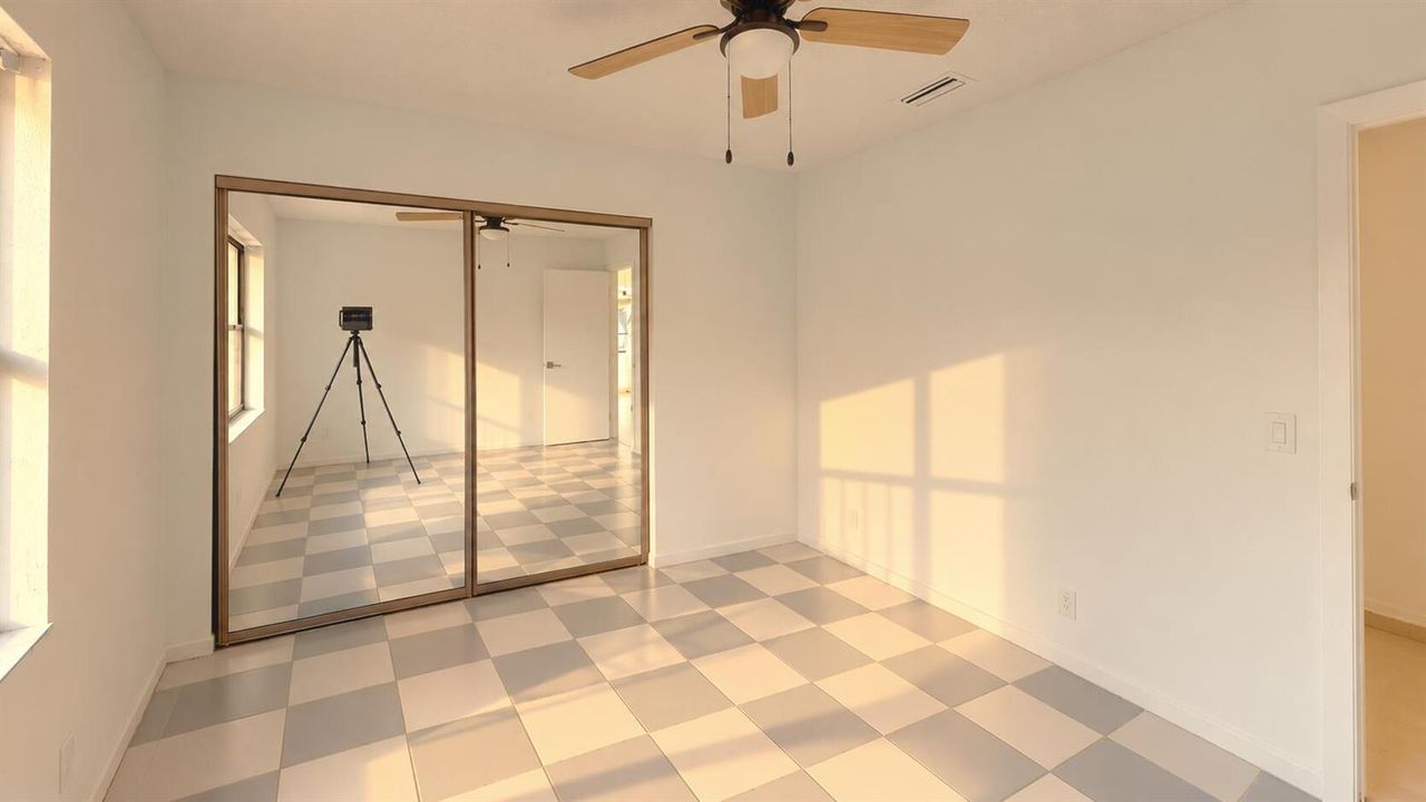 Sunlit_Empty_Room_with_Checkerboard_Floo