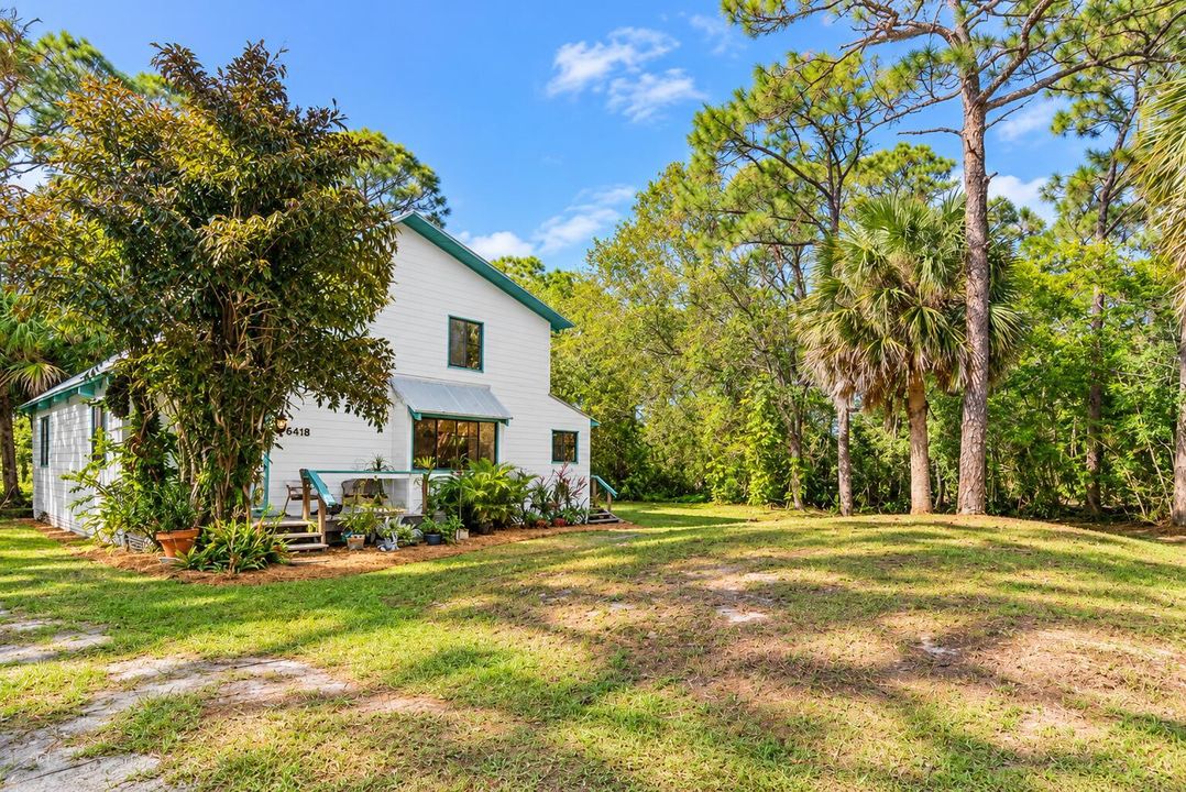 Sunny Woodland Cottage with Teal Trim