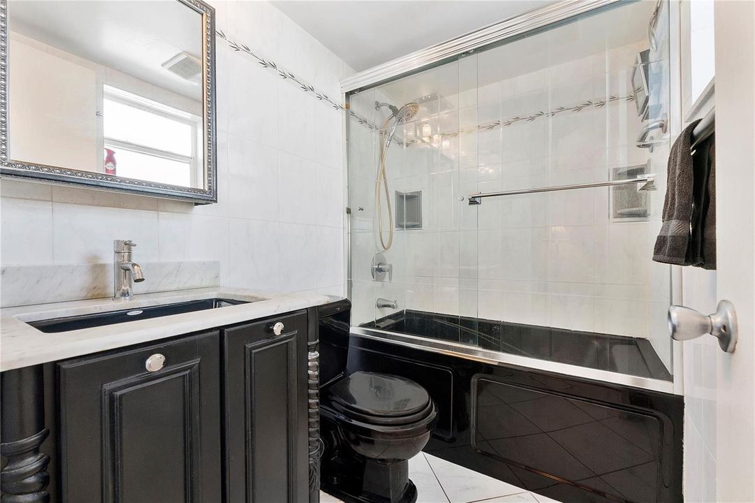Shower with Jacuzzi tub