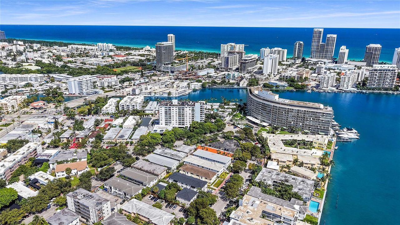 Aerial perspective of a coastal municipality featuring urban infrastructure, waterfront access, high-rise buildings, and proximity to the ocean