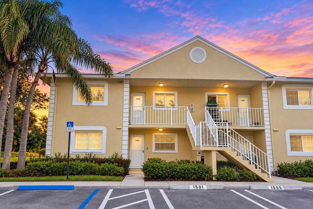 Twilight Condo Facade with Palm Landscap