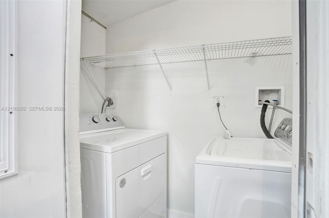 Laundry with full size washer and dryer off the bedroom.