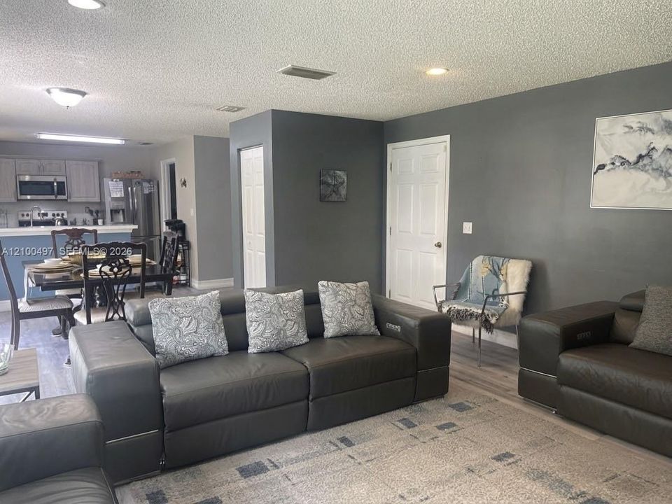 view of kitchen, breakfast area from family room