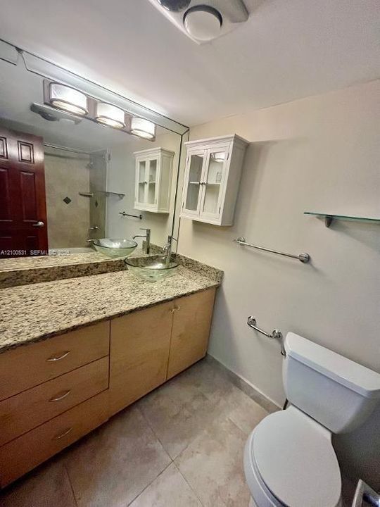 primary bedroom has multiple custom closets throughout