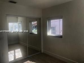 Primary bedroom with good size closet.