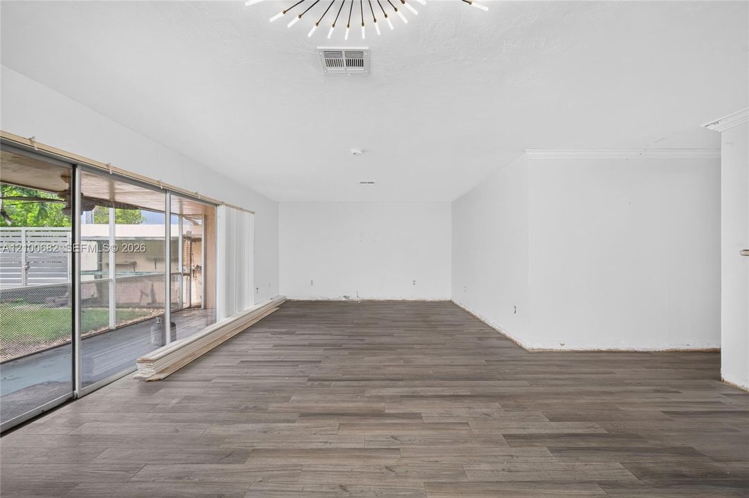 Spacious interior with lots of sliding glass doors leading to the covered patio*