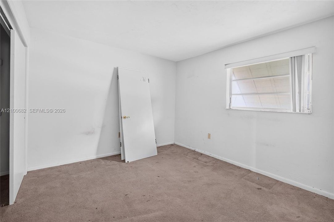 One of the bedrooms where the new flooring has not been installed *