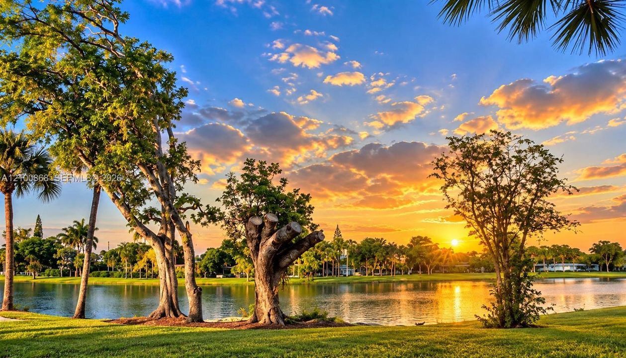 Waterfront lot featuring mature trees, landscaped lawn, and direct pond frontage