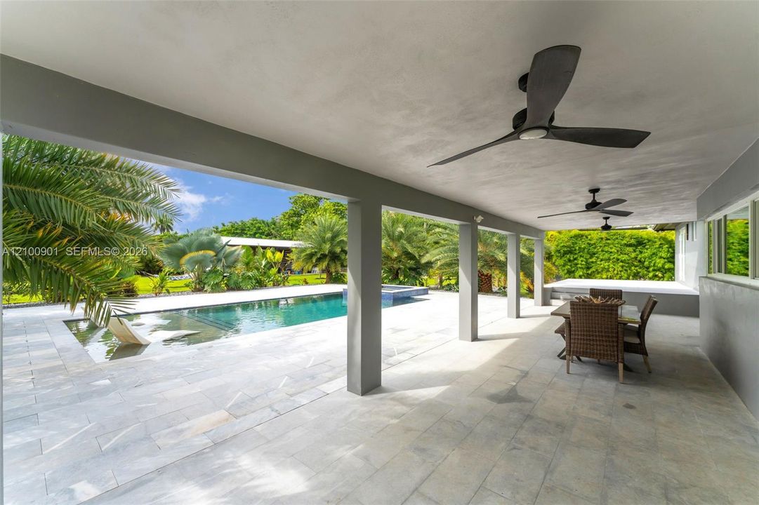 RESORT LEVEL!!!  SMART SALT WATER POOL SYSTEM THATS HEATED.IDEAL FOR THOSE OF US THAT COLOR!..WITH WATERFALL FEATURE, HOT TUB, TANING LEDGE WITH LOUNGERS.THIS IS A BEAUTY.