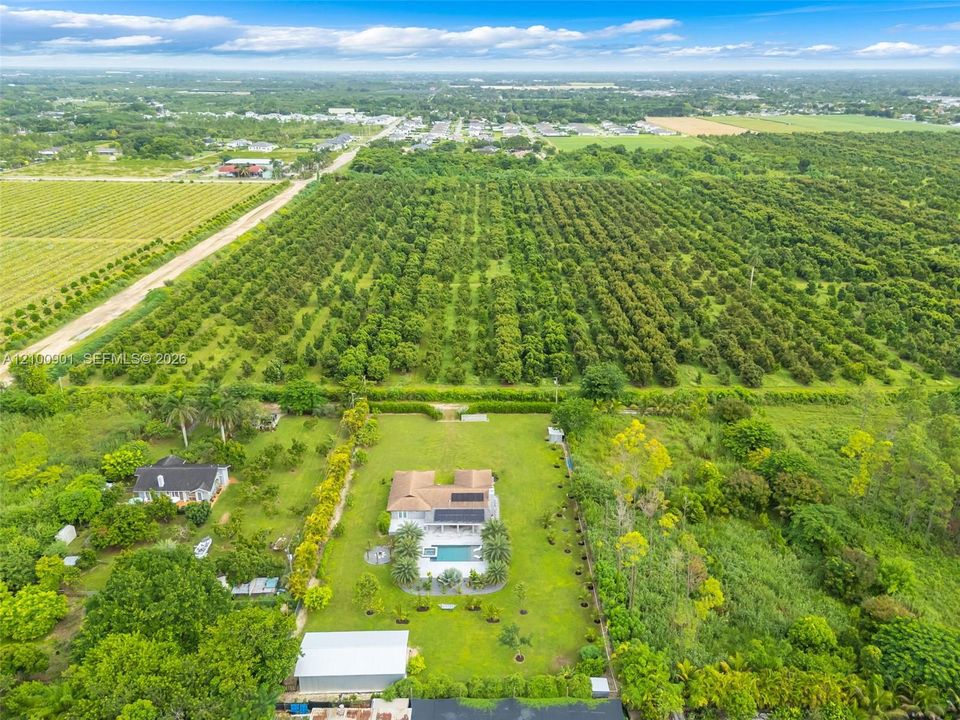 NEIGHBORHOOD IS PRIVATE....  OVERHEAD VIEW OF OUR RANCH HOUSE, POOL/PATIO AND LARGE STEEL BLDG  ELECTRIC GATES OPEN TO GRASS DRIVEWAY