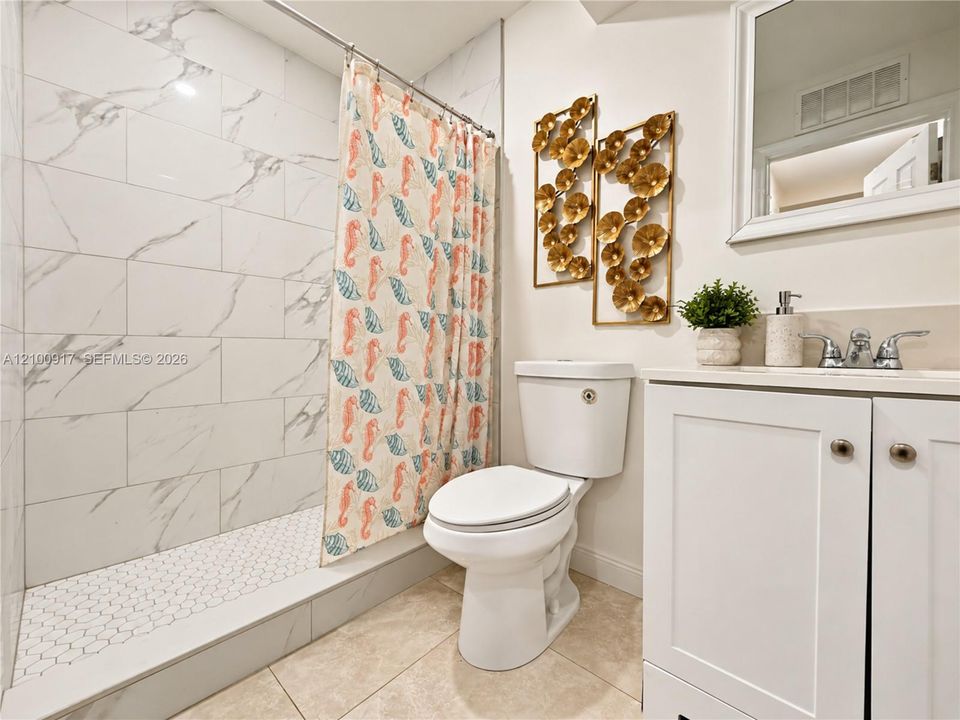 White vanity with an integrated sink and chrome faucet