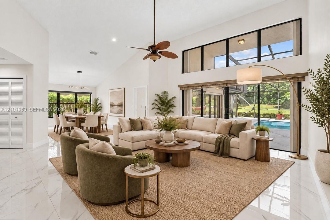 Large porcelain flooring throughout, open, airy with natural light.  Separate dining room- virtually staged