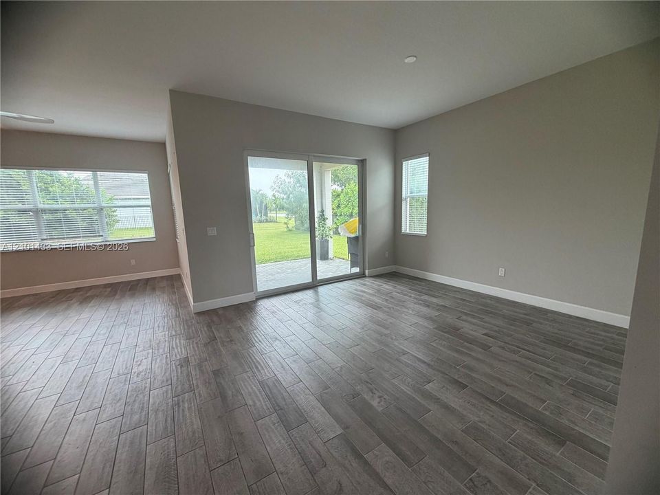 Wood-finish flooring throughout, paired with neutral wall tones