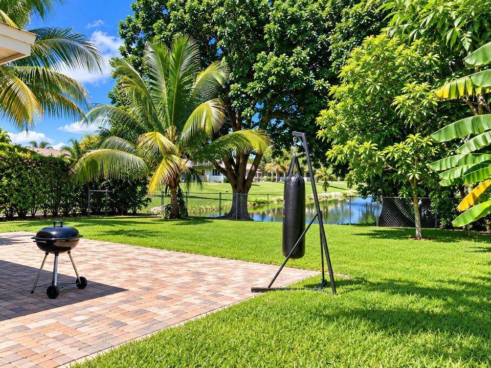 Tropical Backyard Retreat by the Pond