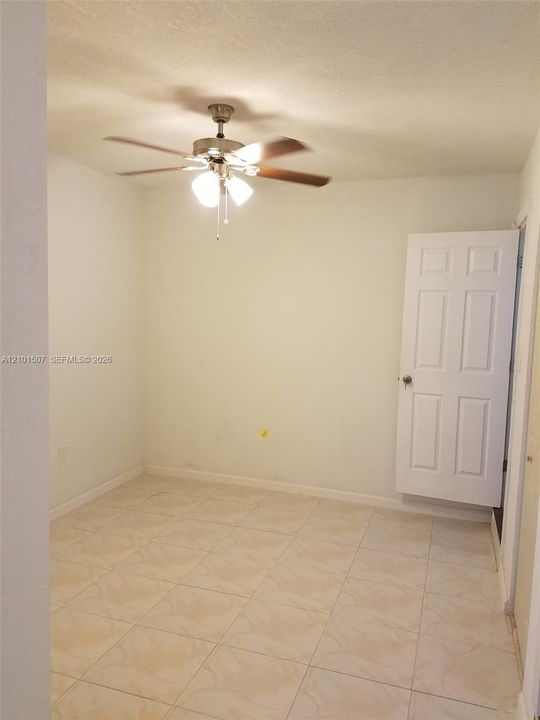Converted space with beige floor - general view