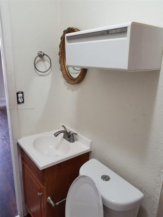 Bathroom 4 - oval mirror and vanity