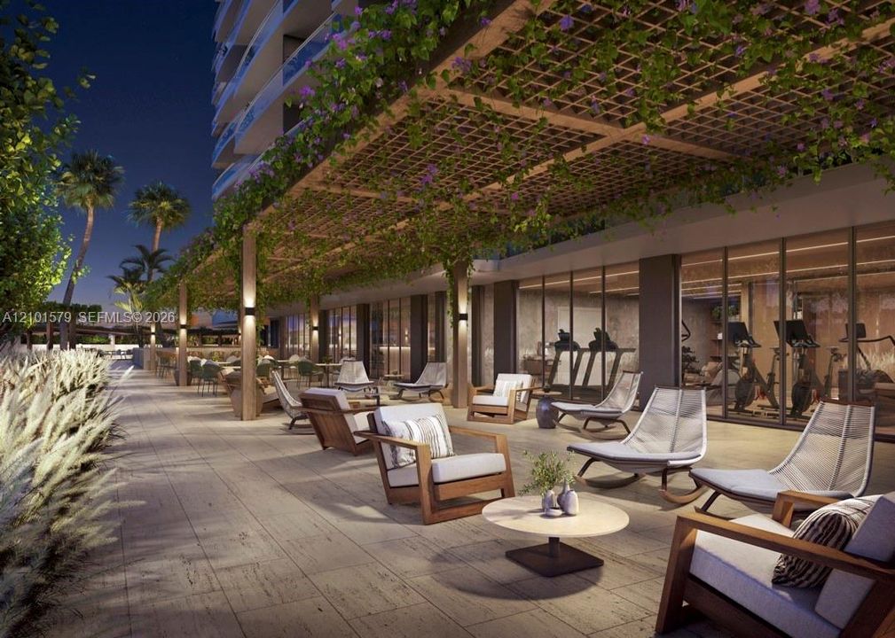 Covered outdoor bar and patio featuring an overhead pergola, integrated landscape, stone-tiled flooring, and recessed wall-mounted lighting