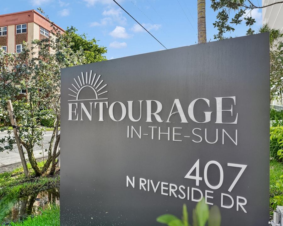 Ground-mounted signage featuring dimensional lettering on a charcoal-finished monument sign
