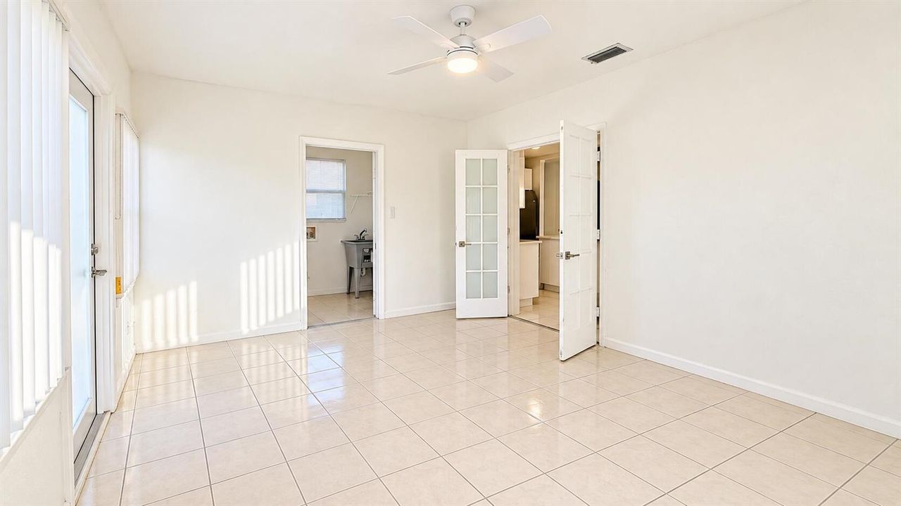 Bright Neutral Room with Open Doorways