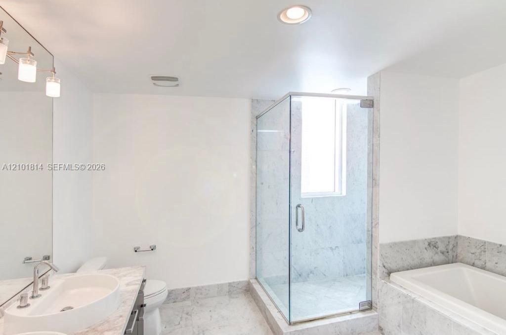 Master bathroom with shower and tub