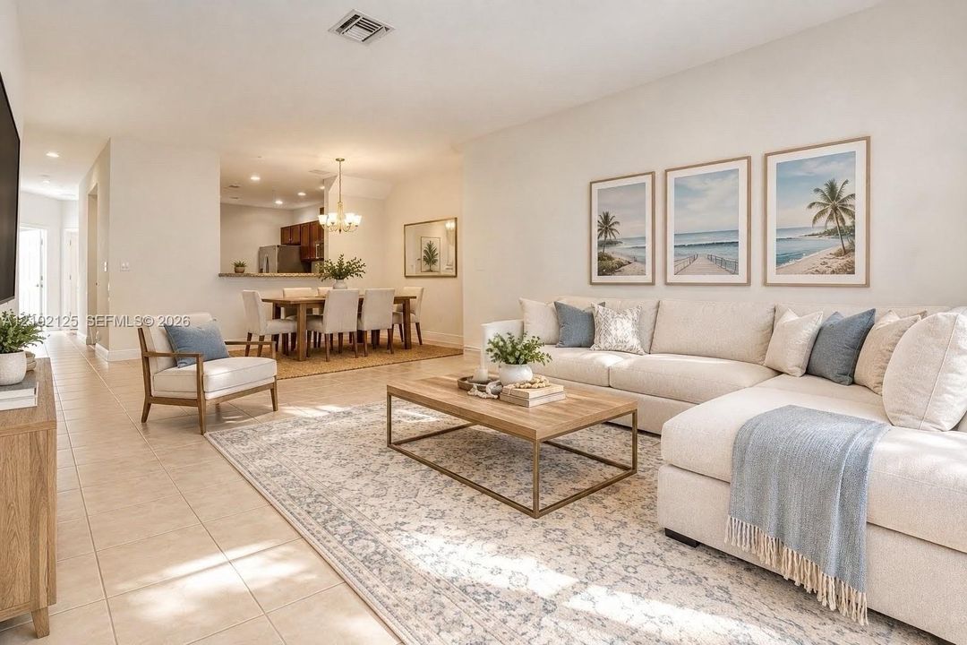 Virtually Stage - Neutral-toned tile flooring, recessed lighting, and a chandelier fixture