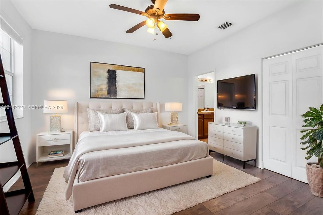 Virtually Stage - Wood-finish flooring, multi-panel interior doors, and a ceiling fan with integrated lighting