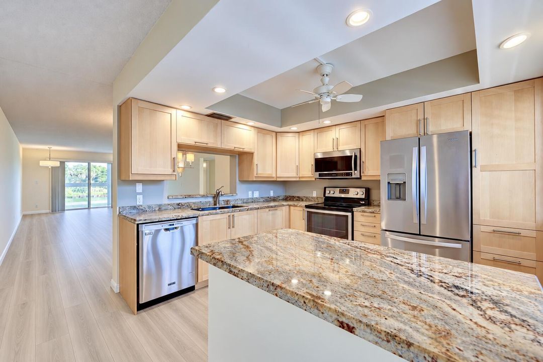 Bright Open-Plan Condo Kitchen and Livin