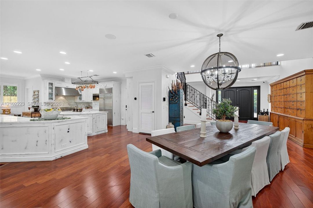 An impressive open concept, dining area offers ample space for a grand dining table, perfect for hosting elegant dinner parties, holiday celebrations and memorable, gatherings beautifully connected to the chef’s kitchen. This expansive space makes entertaining effortless while maintaining a warm inviting atmosphere.