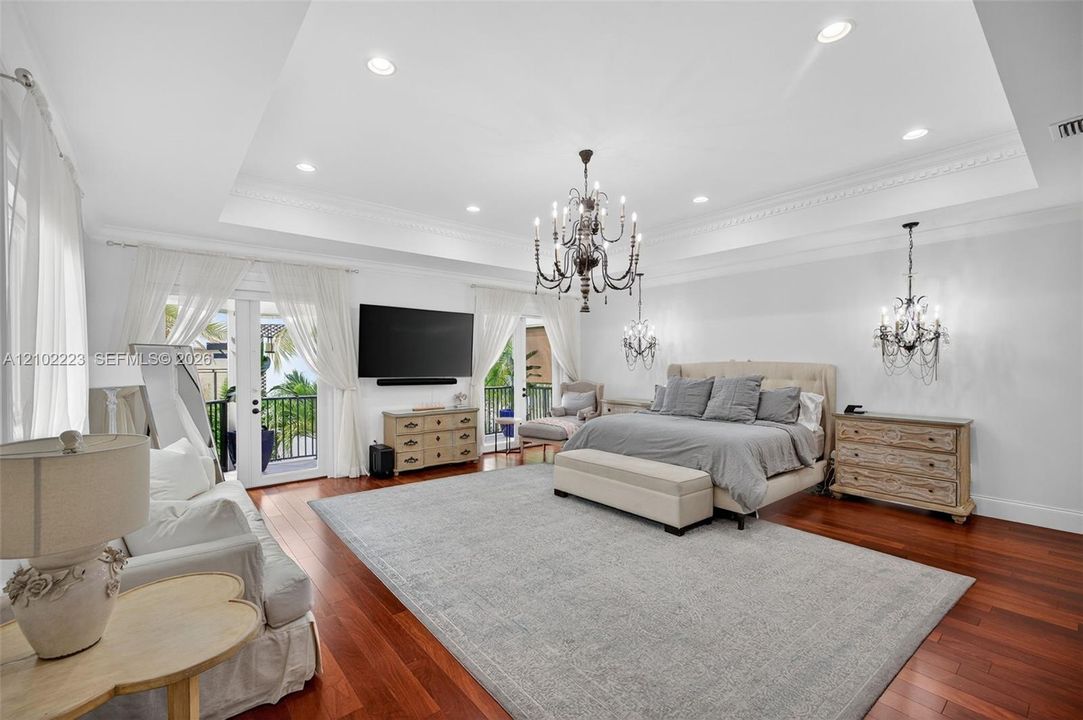 An extraordinary primary suite of truly grand proportions offering a level of space and luxury rarely found this magnificent retreat easily accommodate an expensive private sitting lounge area creating the feeling of a luxurious residence with a residence, soaring tray ceilings, beautiful architectural detail, details, Ridgewood flooring and a private balcony complete the spectacular sanctuary. Undoubtedly one of the most generous proportioned primary suites you’ll find.