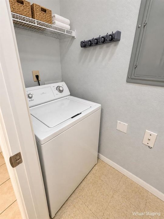 Bright neutral laundry closet (1)