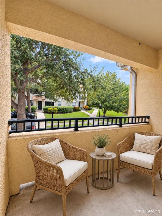Elegant wicker seating on a small balcon
