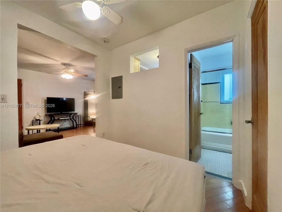 Interior space featuring ceiling fans, recessed wall niches, and wood-finish interior doors