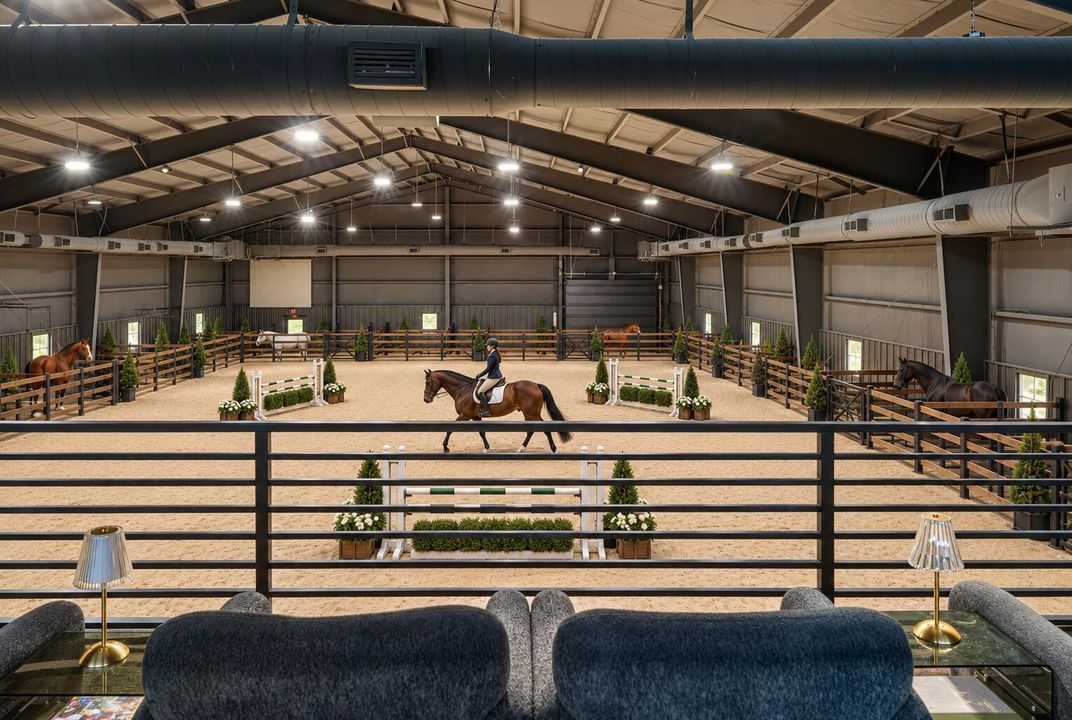 Luxury indoor equestrian arena with hors