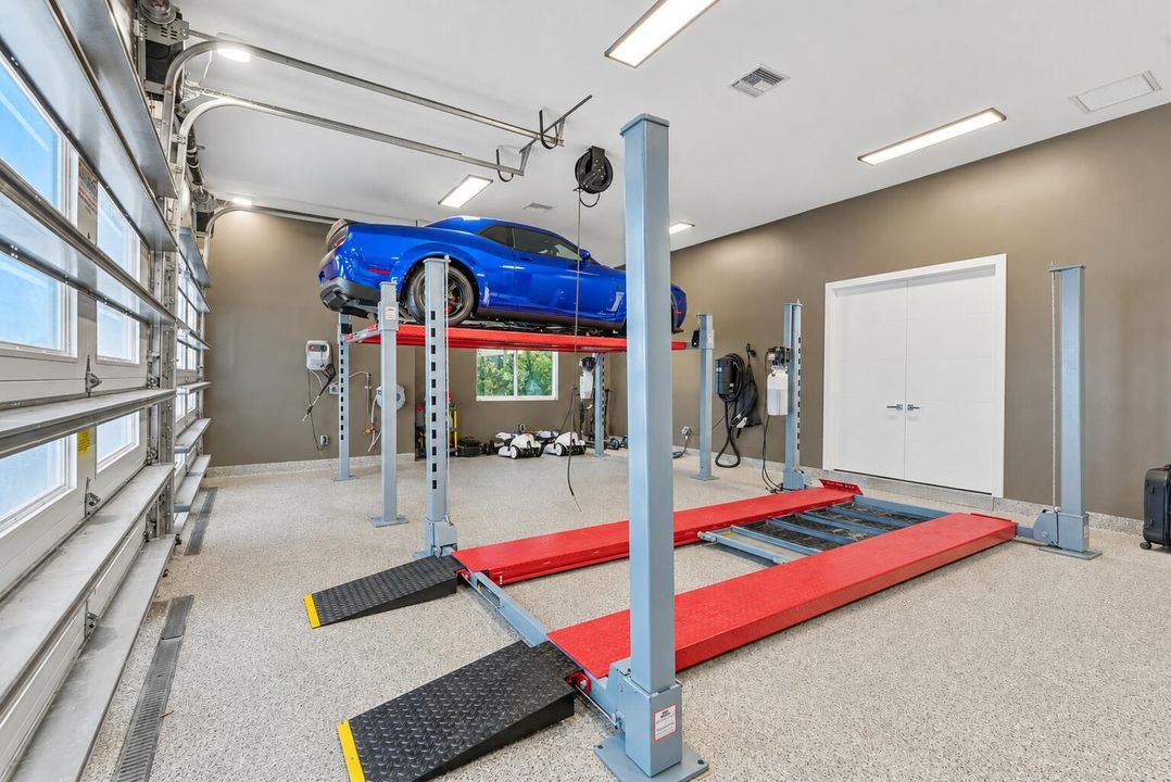 Bright garage with blue car lift