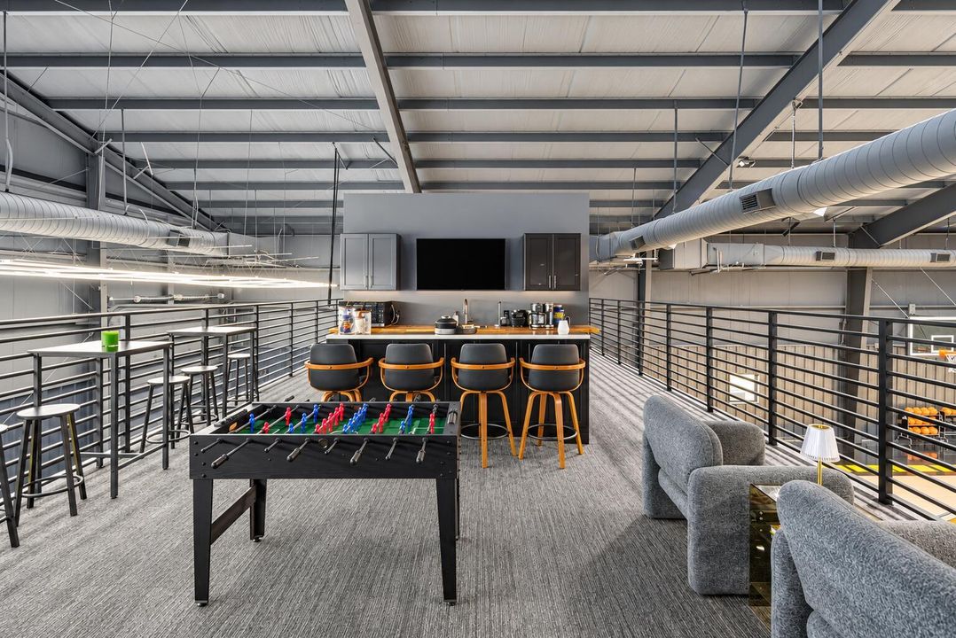 Bright mezzanine lounge above basketball