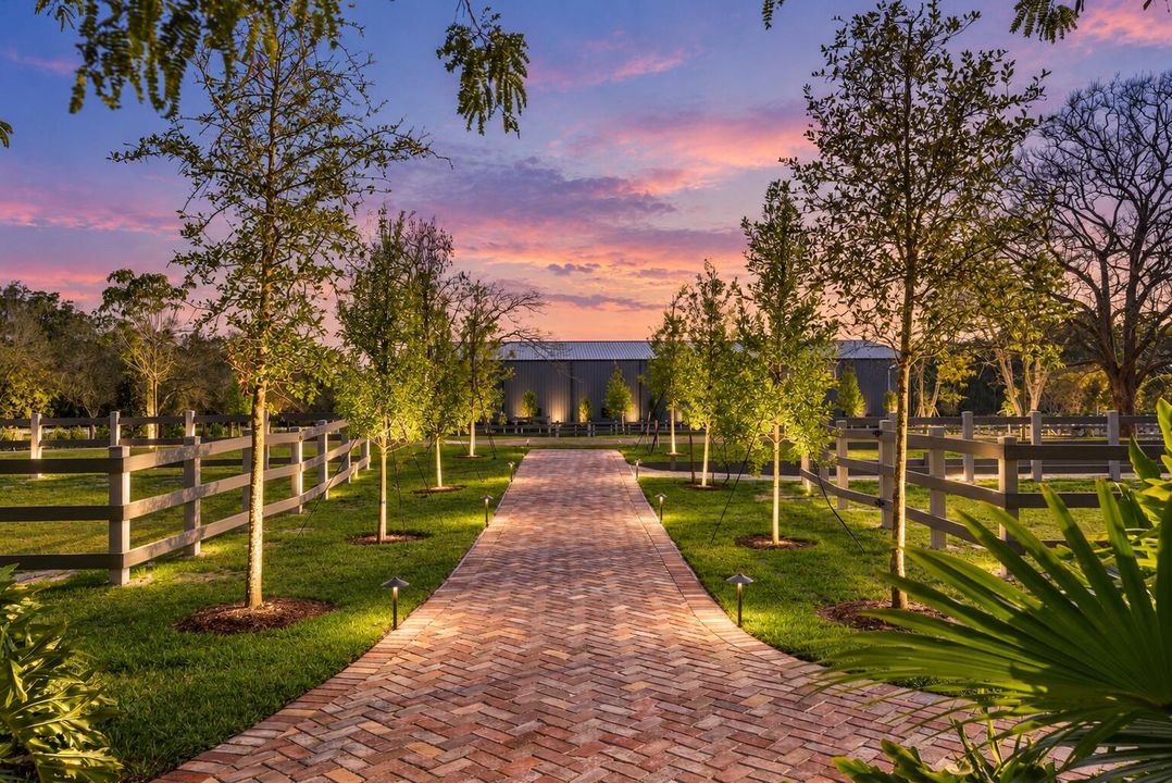 Twilight Estate Walkway with Soft Upligh
