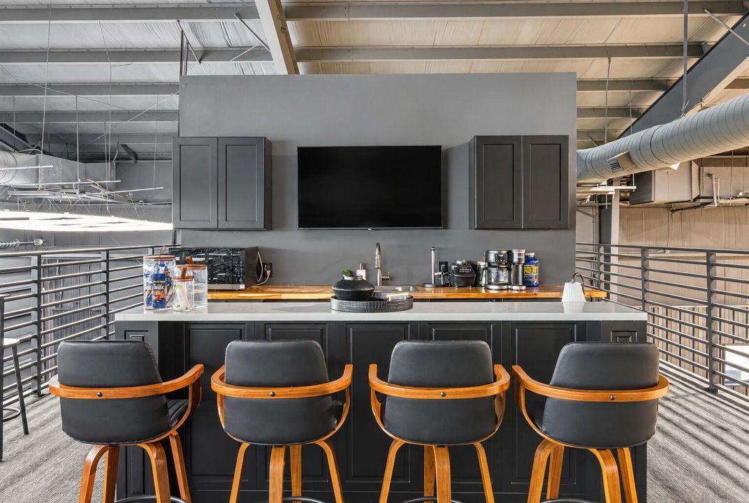Brightened mezzanine kitchenette and bar
