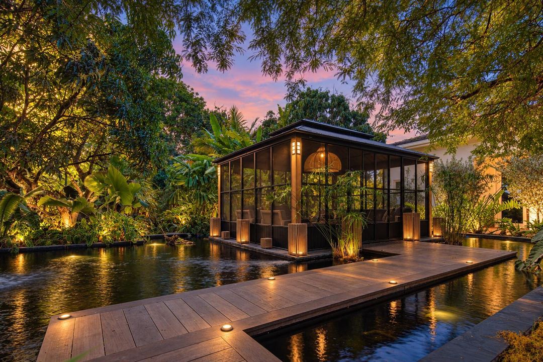 Twilight estate with glowing gazebo and
