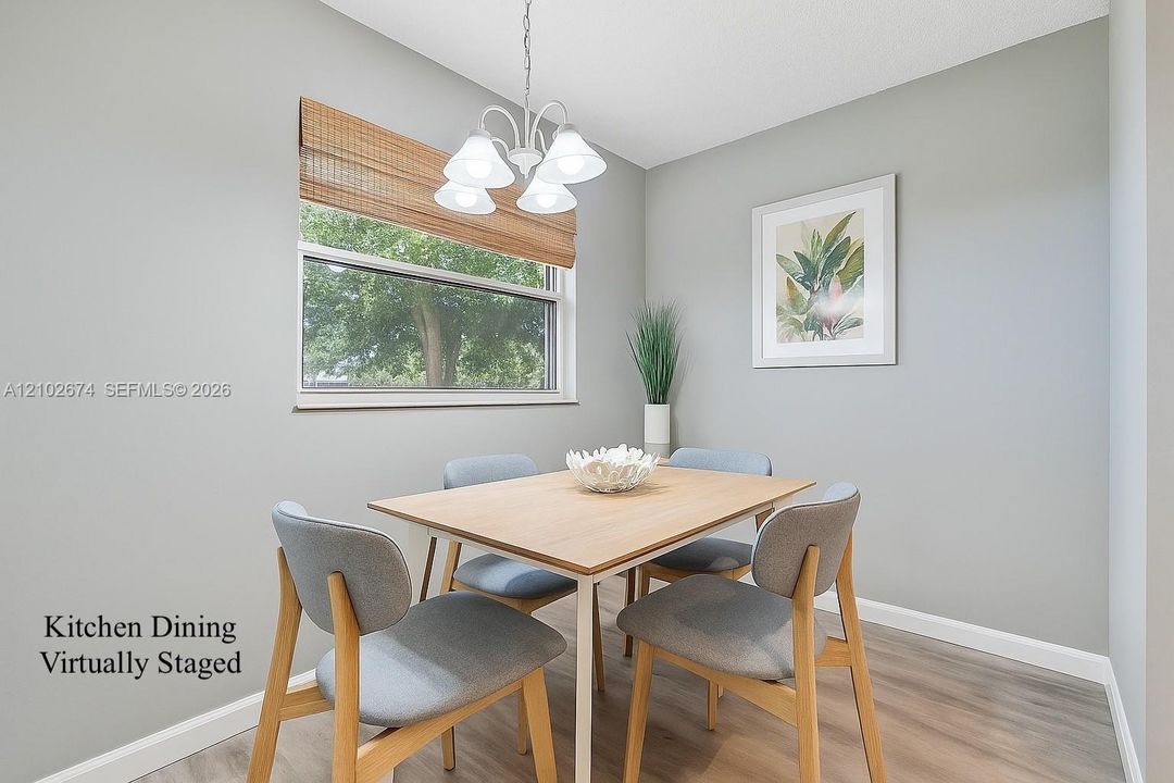 Virtually staged eat-in kitchen dining