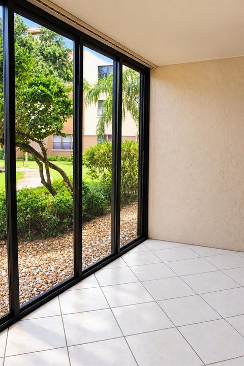Sunlit Screened Patio with Garden Views