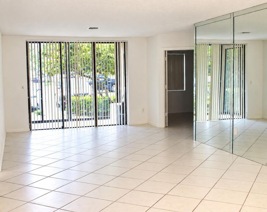 Bright Empty Living Room with Mirrored W