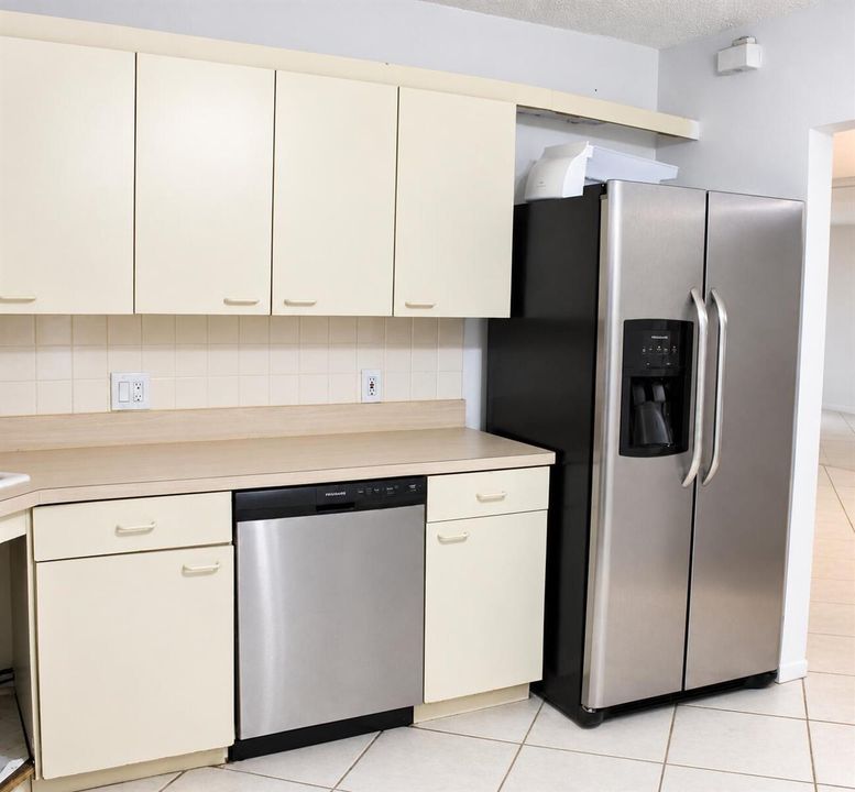 Bright Cream Kitchen with Stainless Appl