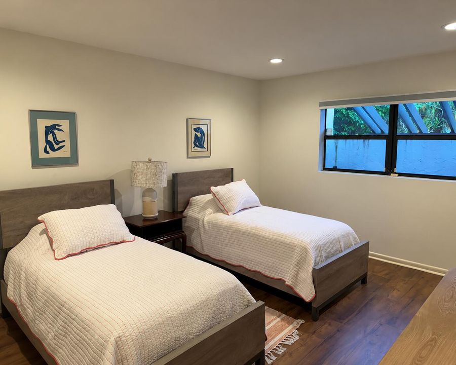 Minimal Twin Bedroom with Blue Artwork