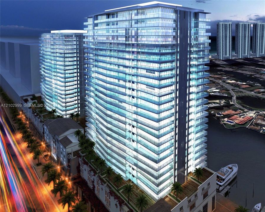 Modern high-rise residential building with numerous balconies and waterfront access