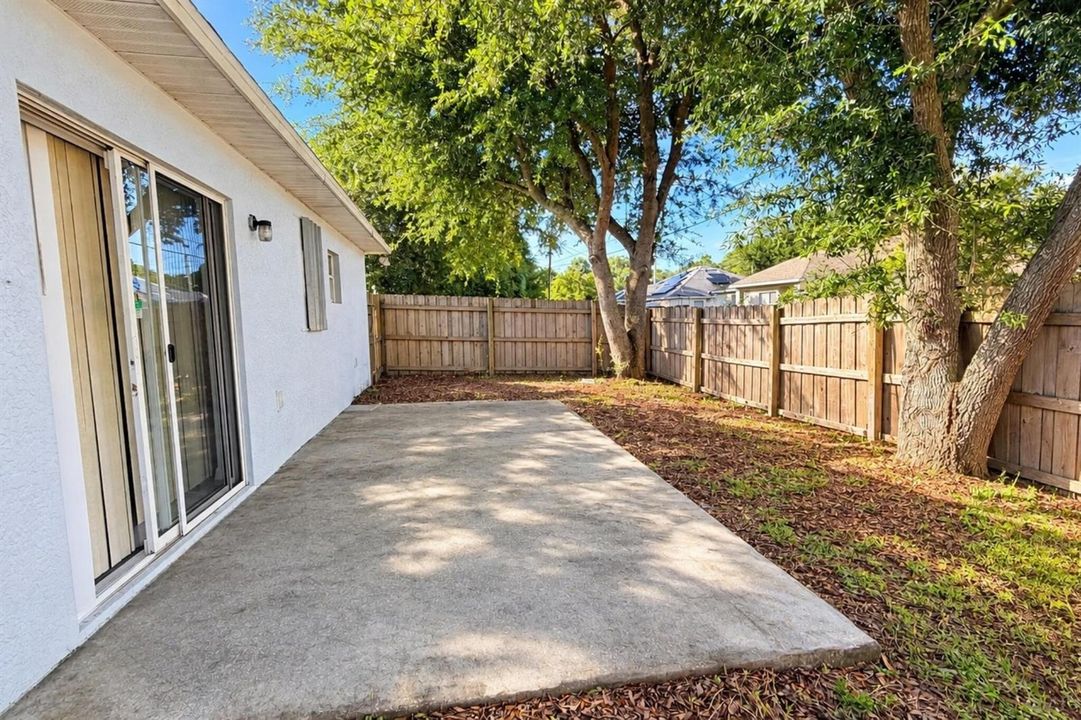 Open Patio Fenced Backyard