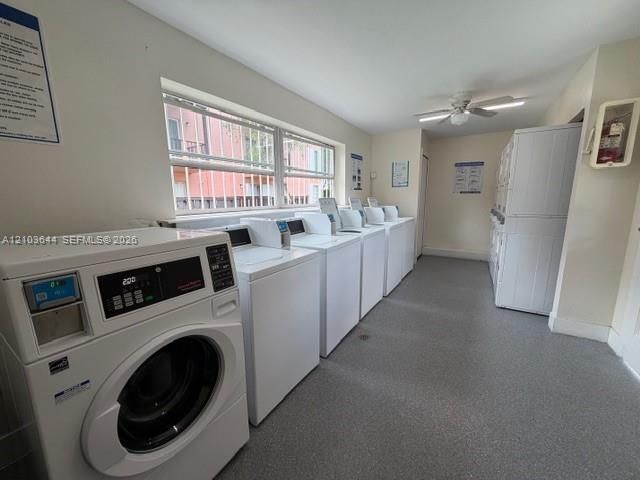 Communal laundry facility featuring multiple commercial-grade front-load washers, stackable dryer units, durable vinyl flooring, and a ceiling-mounted fan