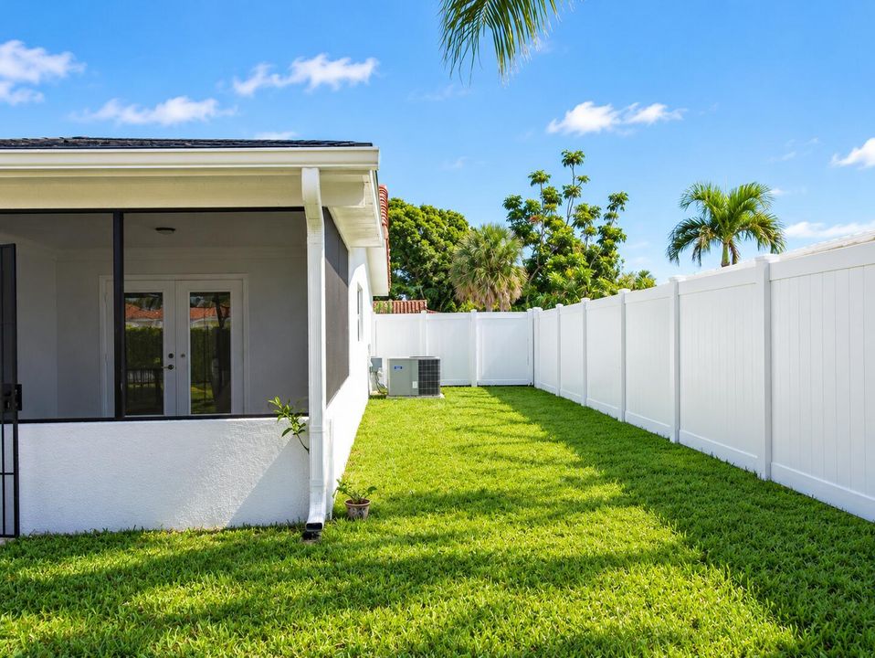 Sunny Tropical Side Yard with Lanai and