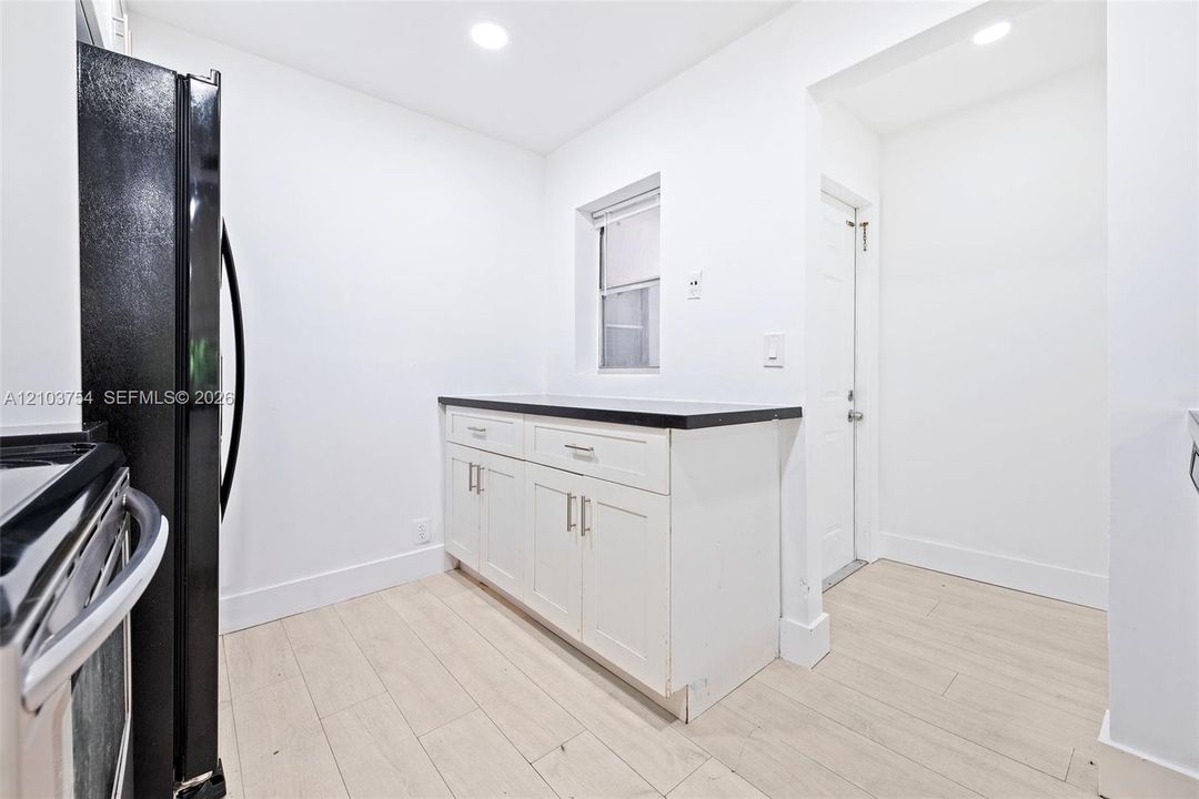 Extra cabinets and counter space with window